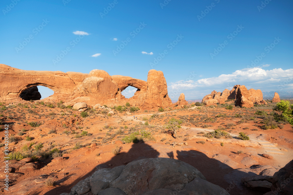 Arches National park at sunset with various rock formations.