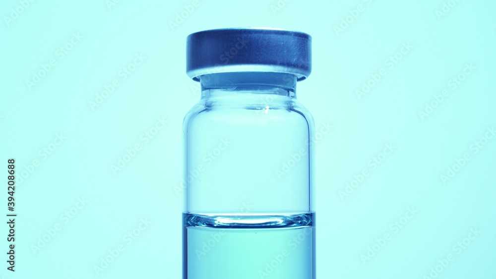 Vaccine vial. Concept of medical research development and production of vaccine against coronavirus, COVID 19. Drugs and medications for pharmaceutical industry. Vaccine vial. Concept of medical research development and production of vaccine against coronavirus, COVID 19. Drugs and medications for pharmaceutical industry.