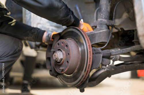 Car mechanic repair brake pads close up. High quality photo