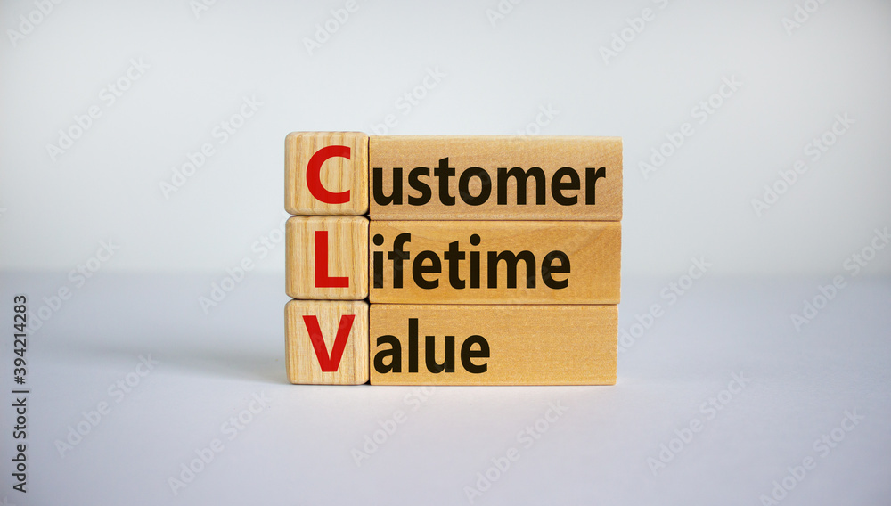 Concept words 'CLV, customer lifetime value' on cubes and blocks on a beautiful white background. Business concept. Copy space. Concept words 'CLV, customer lifetime value' on cubes and blocks on a beautiful white background. Business concept. Copy space.