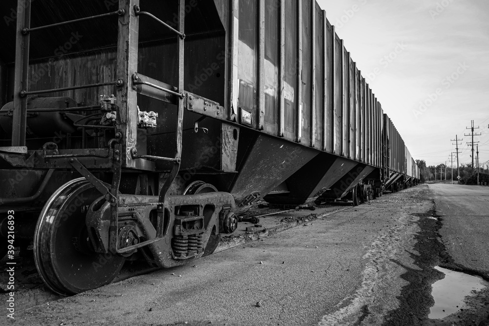 A small train and train cars sitting outside of the salt mines on Lake Erie in Northeast Ohio.