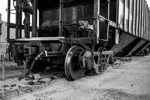 A small train and train cars sitting outside of the salt mines on Lake Erie in Northeast Ohio.