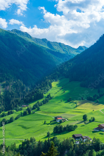 Fototapeta Naklejka Na Ścianę i Meble -  Mountain valley village landscape in Venediger alps . Mountain green valley village view austria near matrei in osttirol