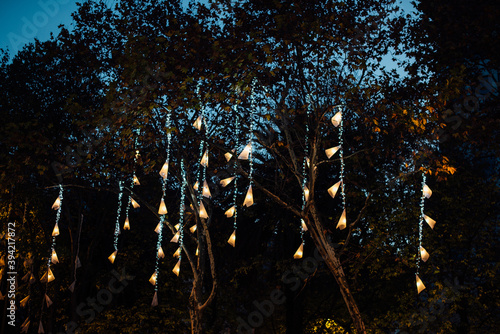 European street decorated for Christmas celebration. Avenida da Liberdade in Lisbon illuminated with lights hanging from the trees. 