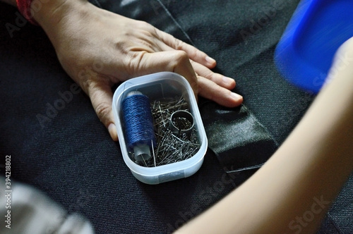 Tailor man working in his tailor shop, Tailoring, close up photo