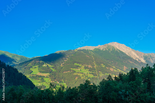 Mountain valley village landscape in Venediger alps . Mountain green valley village view austria near matrei in osttirol