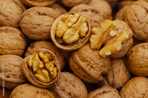 Some walnuts on dark table