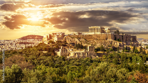 Acropolis of Athens at sunset, Greece. Sunny panorama of Greek ruins. photo