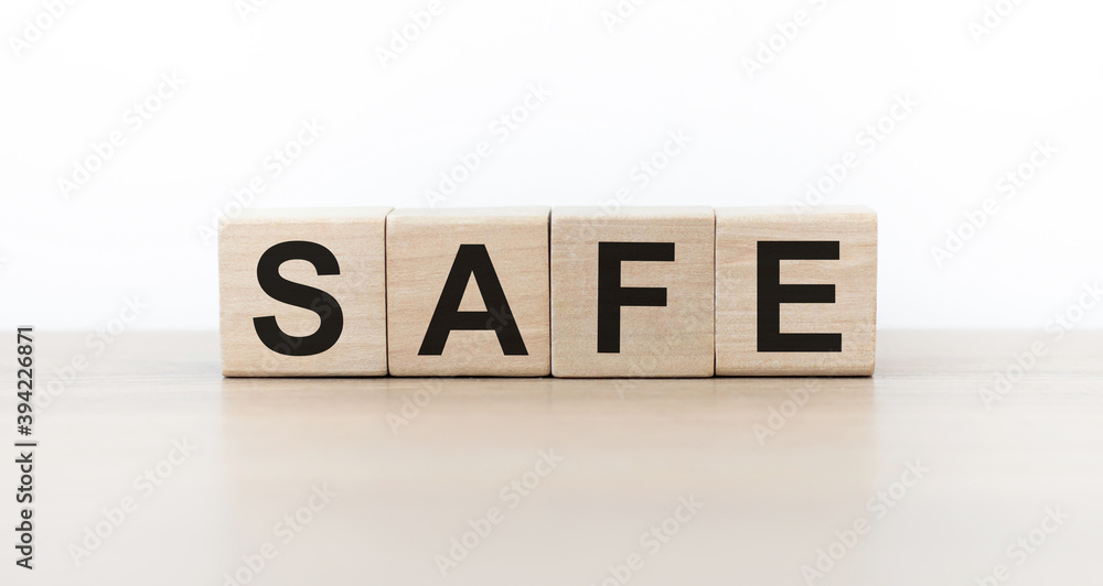 SAFE Word Written In Wooden Cubes On an isolated light table SAFE Word Written In Wooden Cubes On an isolated light table