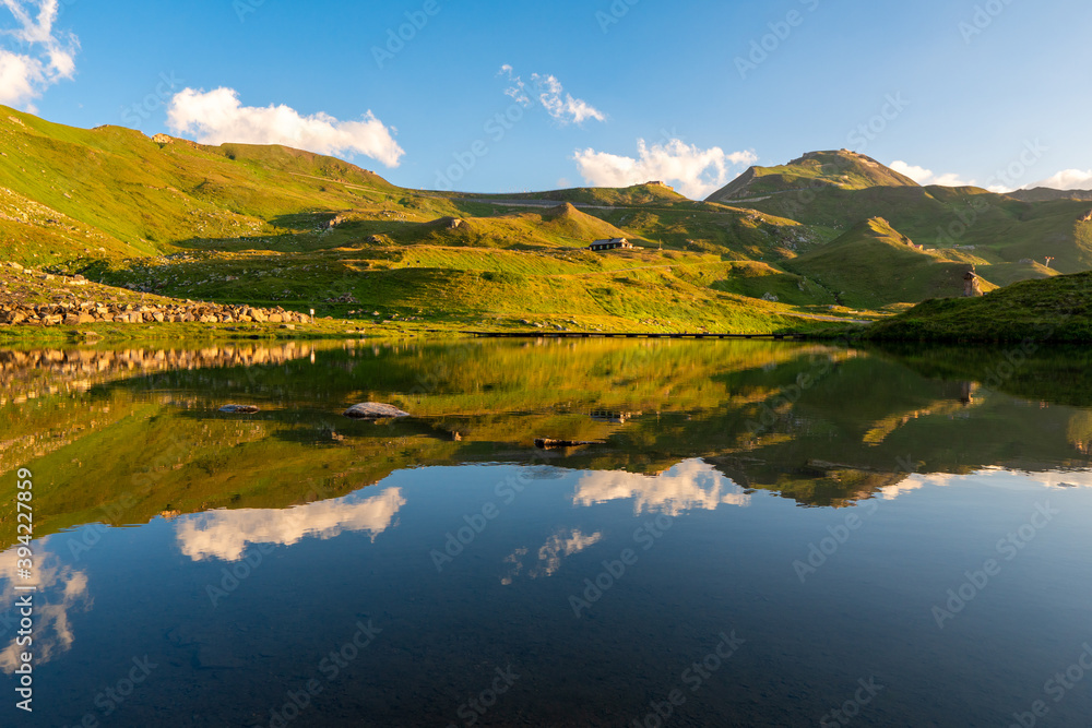 Sunrise view on lake on grossglockener with reflection. Location Grossglockner high alpine road, Austria, Europe. National park in Tyrol.
