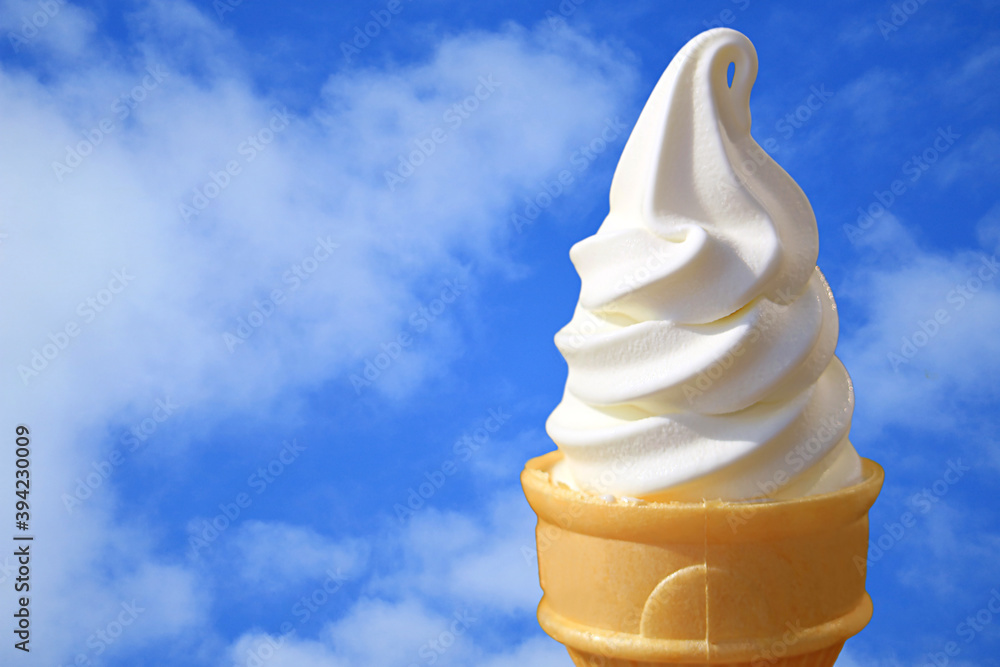 Pure White Vanilla Soft Serve Ice Cream Cone Against Sunny Blue Sky