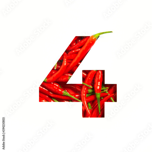 Number four made of red chili pepper, paper cut in shape of fourth numeral isolated on white. Typeface of vegetables photo