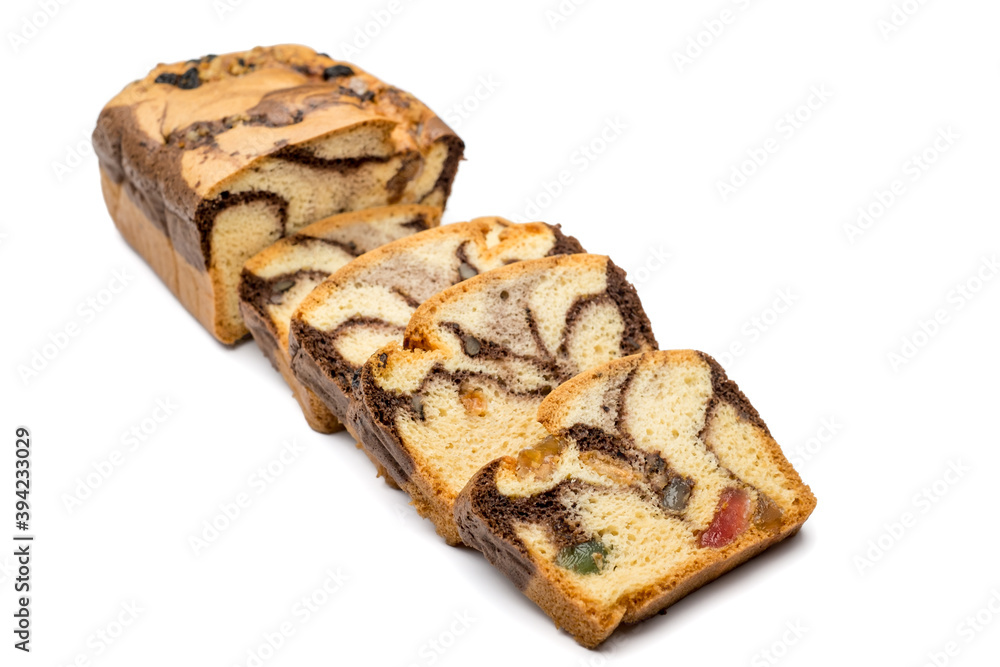 Slices of Romanian sponge cake with cocoa, turkish delight and raisins