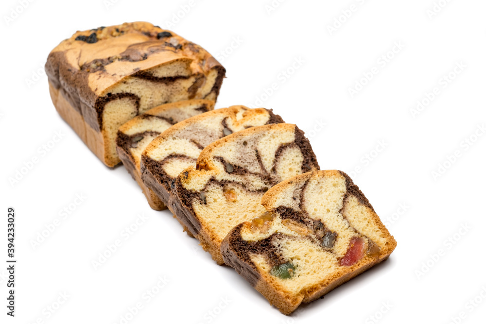 Slices of Romanian sponge cake with cocoa, turkish delight and raisins Slices of Romanian sponge cake with cocoa, turkish delight and raisins