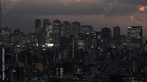 Wallpaper Mural TOKYO, JAPAN : Aerial high angle sunrise CITYSCAPE of TOKYO. View of office buildings at downtown area around Shinjuku. Japanese urban metropolis concept shot. Long time lapse shot night to morning. Torontodigital.ca