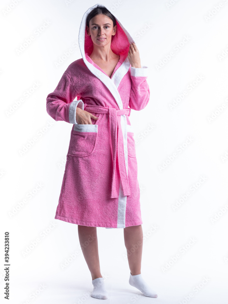 woman in a Bathrobe on an isolated white background with a smile on her face. woman in a Bathrobe on an isolated white background with a smile on her face.
