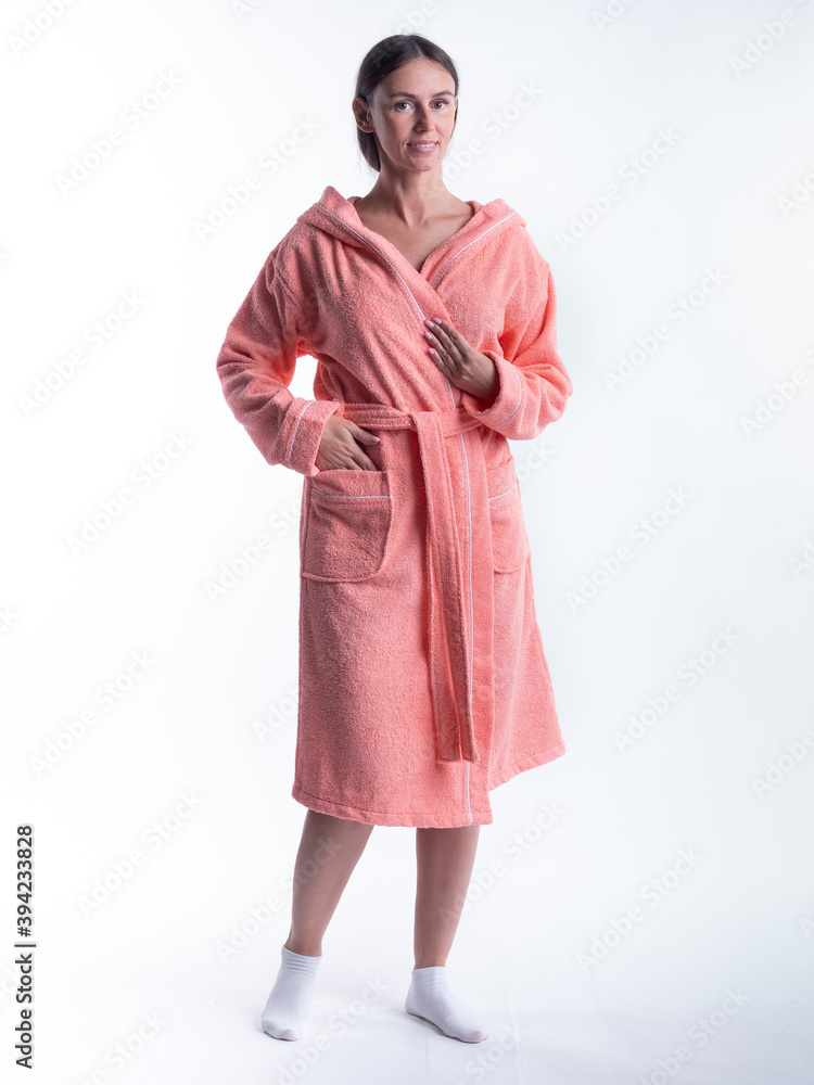 woman in a Bathrobe on an isolated white background with a smile on her face. woman in a Bathrobe on an isolated white background with a smile on her face.