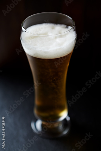 Glass of beer on dark background. Close up. 