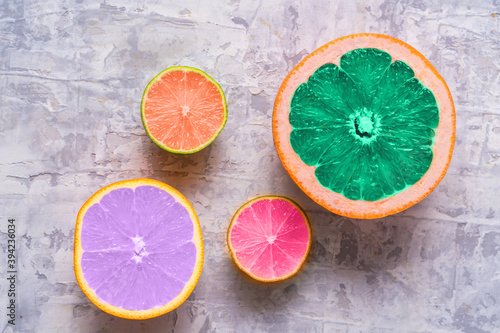Fototapeta Naklejka Na Ścianę i Meble -  Fresh slices of different Citrus fruit - orange fruit, lime, lemon and grapefruit toned in trendy colors of 2021 year.