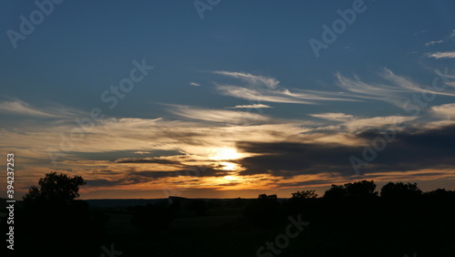 Sunset in the field with clouds