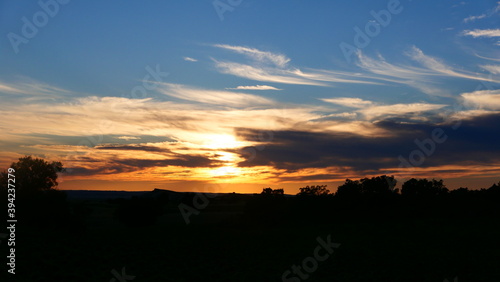 Sunset in the field with clouds