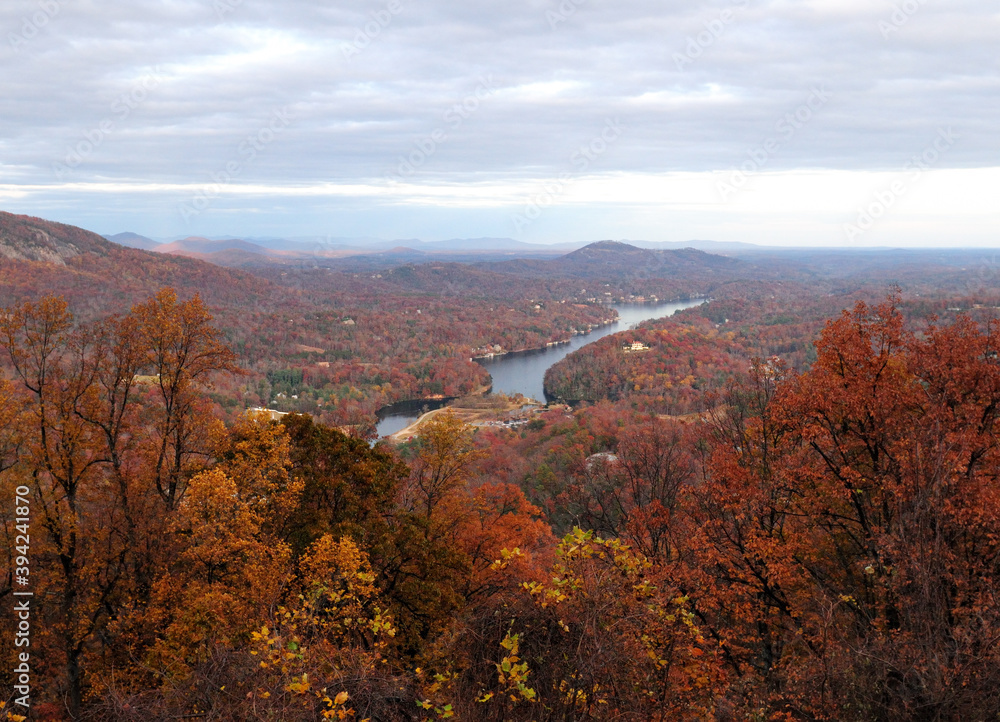 View To Red Colored Trees At Lake Lure And Broad River During Indian Summer From Chimney Rock North Carolina On A Cloudy Autumn Day