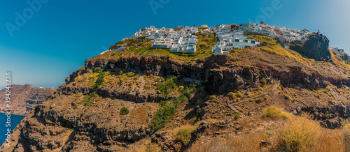 A view towards the clifftop village of Imerovigli from Skaros Rock in summertime