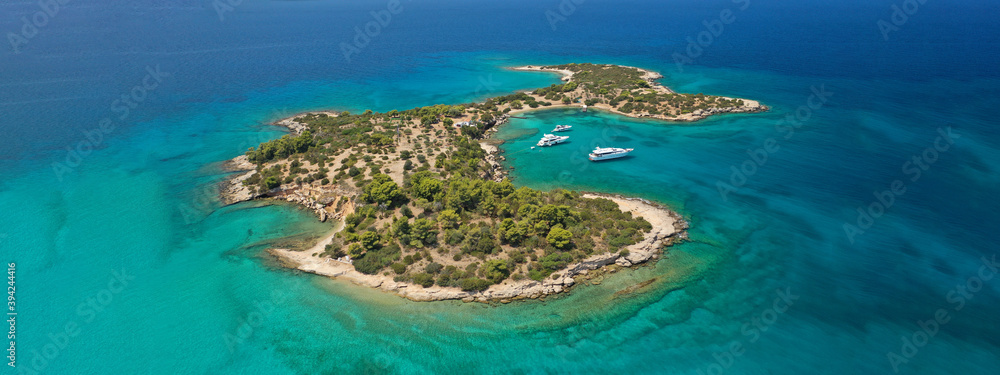 Aerial drone ultra wide photo from paradise bay and small island of Chinitsa near famous Porto Heli, Argolida, Peloponnese, Greece