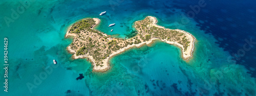 Aerial drone ultra wide panoramic photo of tropical exotic mediterranean bay with luxurious yachts and turquoise sea