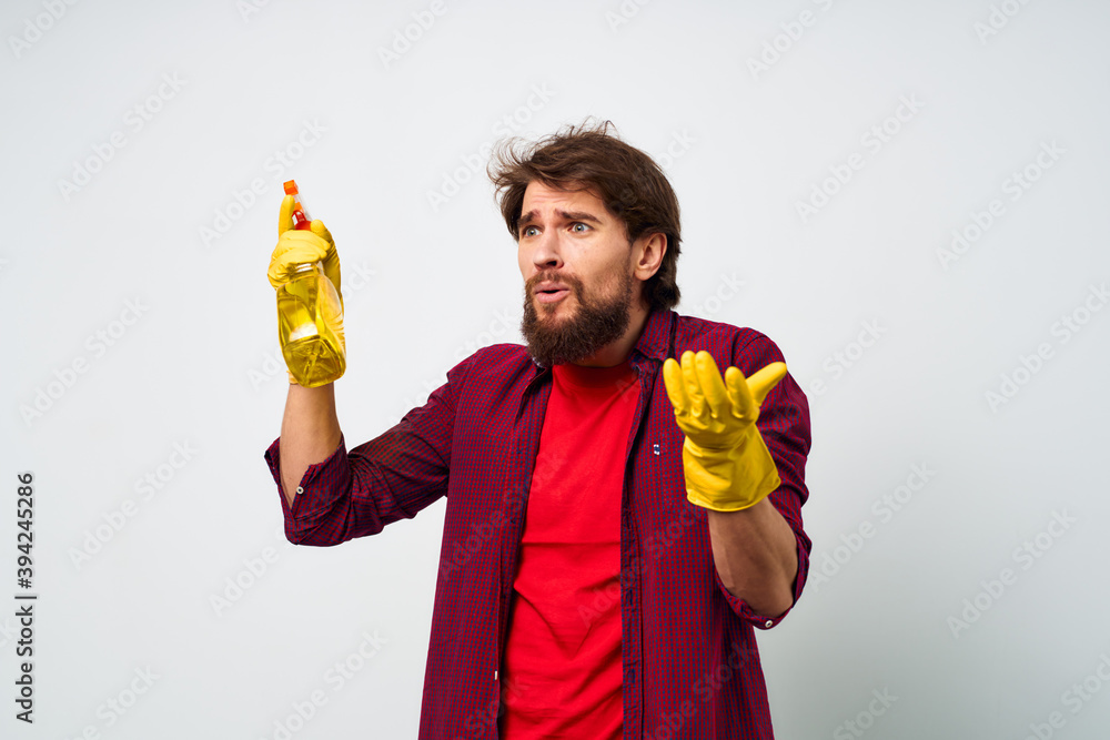 Cleaner with detergent in rubber gloves hands professional service rendering cropped view of homework Cleaner with detergent in rubber gloves hands professional service rendering cropped view of homework