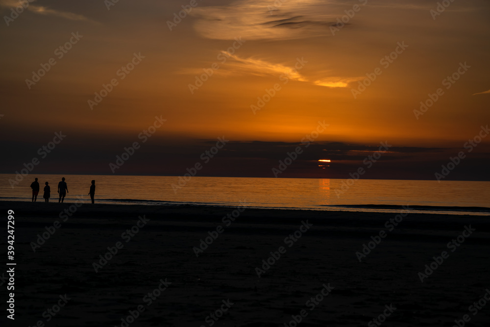 Amazing sunset beach with clouds