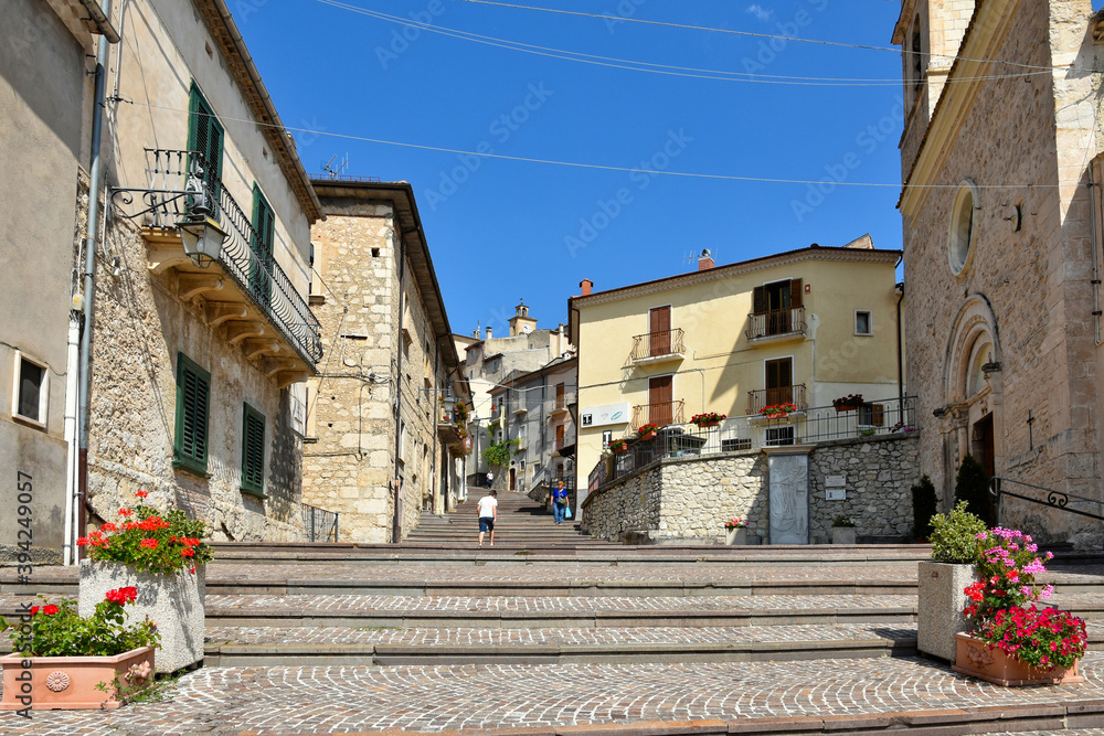 A narrow street among the old houses of Villalago, a medieval village in the Abruzzo region.