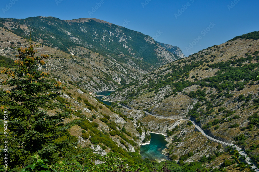 A river crosses a valley in the mountains of Villalago, a town in the Abruzzo region of Italy.