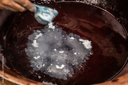 Traditional mud-dyeing process for Oshima pongee_03