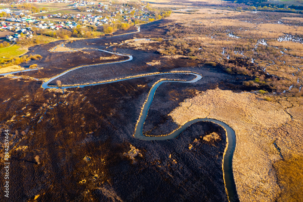 Aerial photography of the burning and scorched dry fields.