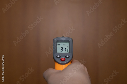Holding a temperature meter