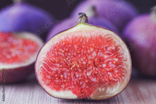 Fresh ripe figs fruits (common fig or Caprifig / Ficus carica) on wooden background. photo