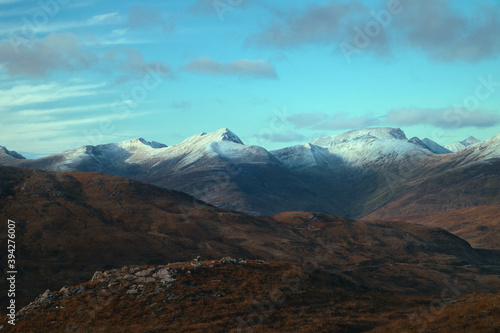 Magnificent landscape of mountain peaks covered snow at sunset. View from The Devils Staircase to Binnein Mor that is the highest summit of the Mamores range. Highlands, Scotland