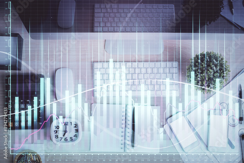 Multi exposure of forex graph drawing over desktop background with computer. Concept of financial analysis. Top view. © peshkova