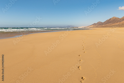 Footprints in sand on Cofete beach  Fuerteventura island