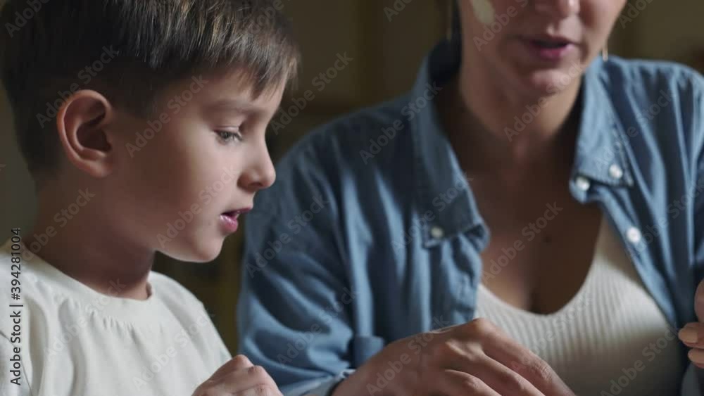 Mother and son plays with clay at home Mother and son plays with clay at home