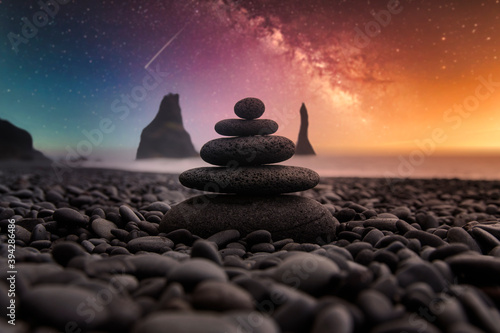 Zen stones in balance with the milky way background