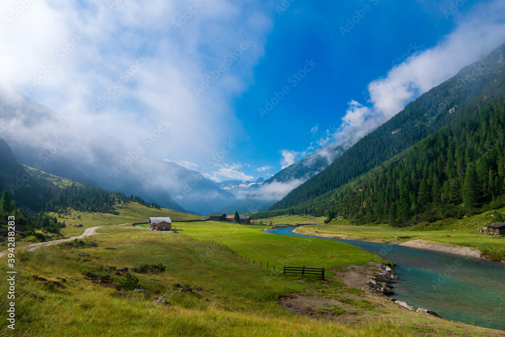 Alpine landscape. High mountain alpine valley at summer. Tourist route Krimml Waterfalls - Hohe Tauern National Park. Austria. Famous tourism destination, tourist attraction