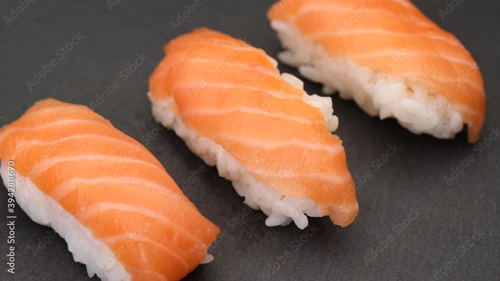 Sushi nigiri salmon Asian typical food. Raw fish and rice Japan gourmet. Sushi nigiri salmon Asian typical food. Raw fish and rice Japan gourmet.