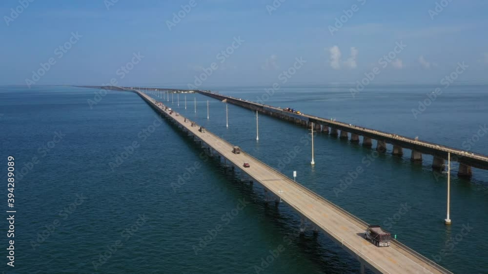 Drone clip of dumptrucks driving down seven mile bridge near Key West Drone clip of dumptrucks driving down seven mile bridge near Key West