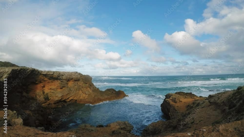 Timelapse of ocean cliff and breaking waves on a rocky section of Warrnambool. Nature scape at sea water with dramatic crashing waves at rock on cloudy stormy day. Cinematic timelapse video. Timelapse of ocean cliff and breaking waves on a rocky section of Warrnambool. Nature scape at sea water with dramatic crashing waves at rock on cloudy stormy day. Cinematic timelapse video.