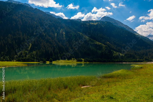 Durlassboden reservoir in the Zillertal Alps, mountain lake with reflection in austria