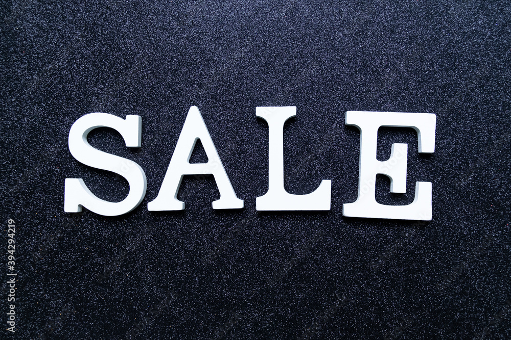 White letters SALE on black glitter background. black friday, cyber monday and seasonal sales banner White letters SALE on black glitter background. black friday, cyber monday and seasonal sales banner