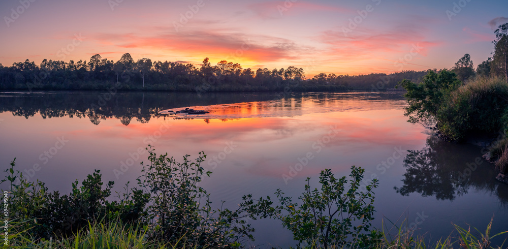 Beautiful Panoramic Riverside Sunrise with Cloud Reflections