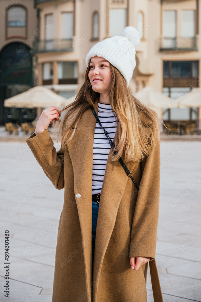 Portrait of a beautiful young woman with winter clothes